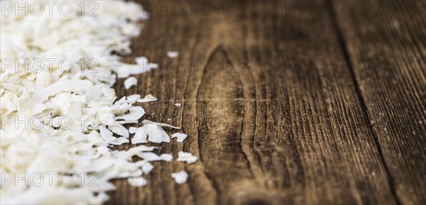 Fresh Coconut Flakes as detailed close-up shot (selective focus)