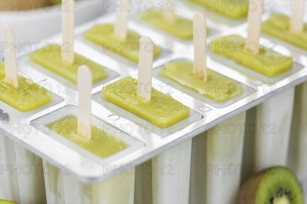 Kiwi Popsicles (fresh) as detailed close-up shot, selective focus)