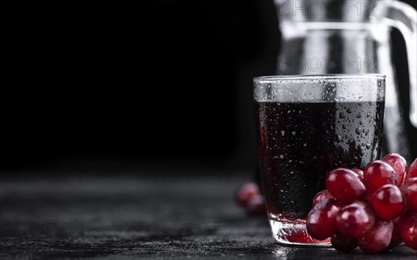Some fresh Red Grape Juice (selective focus, close-up shot)