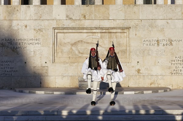 Two Evzones in traditional dress in front of the parliament building, Tomb of the Unknown Soldier,