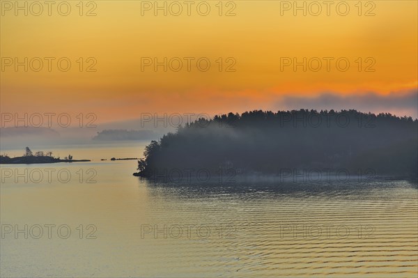The Stockholm Archipelago along the Swedish coastline seen from the Baltic Sea with dramatic orange