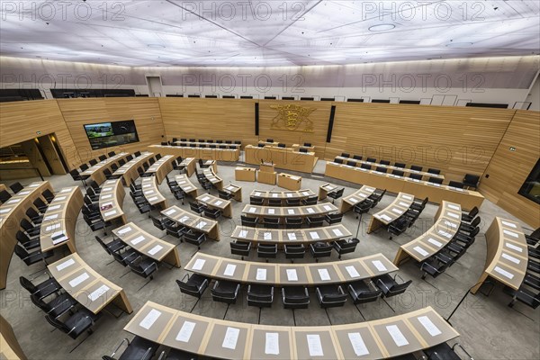 State parliament of Baden-Württemberg, assembly hall with state coat of arms. The seats of the