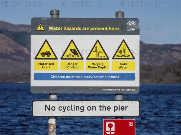 Warning sign at the beach, village Luss, Lake Lomond, potential water hazards, Scotland, UK