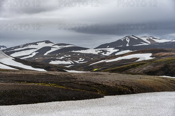 Volcanic landscape with hills and snow, Laugavegur trekking trail, Landmannalaugar, Fjallabak