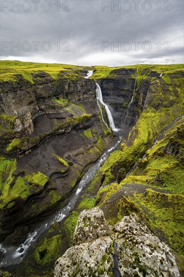 River and waterfalls at a canyon with green moss, Haifoss and Granni waterfall at a canyon, Fossá í