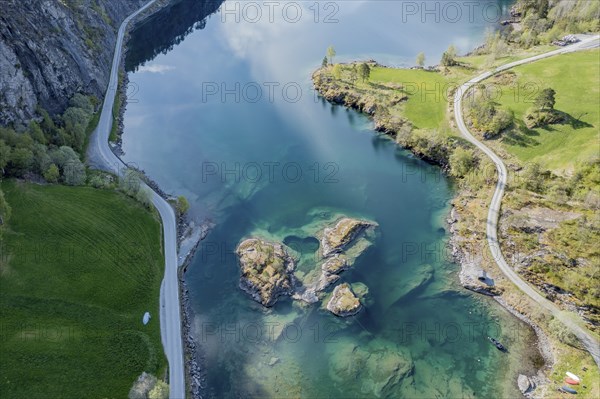 Aerial view of islands in lake Lovatnet (or: Loenvatnet), roads along the lake, valley Lodalen