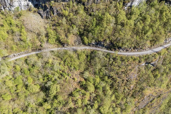 Aerial view of road along lake Lovatnet (or: Loenvatnet), gravel mountain road to Kjenndalstova,