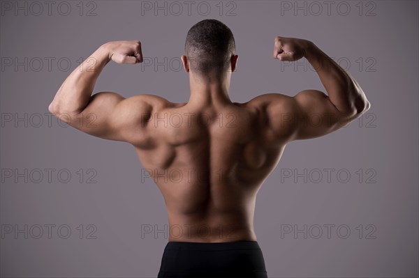 Bodybuilder doing a Back Double Biceps pose