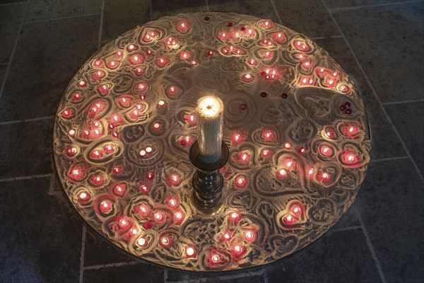 Burning devotional candles on sand in the Lorenzkirche, Nuremberg, Middle Franconia, Bavaria,