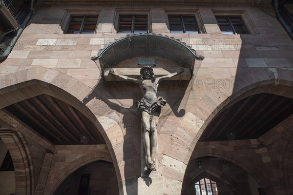 Crucifix in the inner courtyard of the historic Heilig-Geist-Spital, Nuremberg, Middle Franconia,