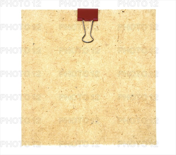 Old Style Paper With Red Metal Clip Isolated On White