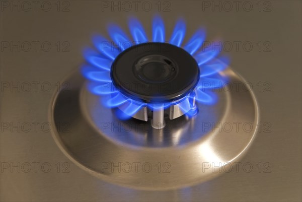 Blue gas flames of a steel gas stove
