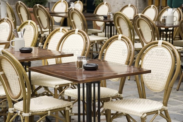 Typical munich stgreet cafe with wicker chairs