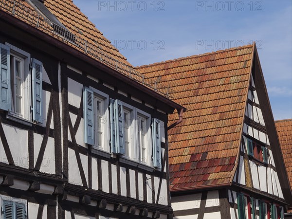 Traditional half-timbered houses with red tiled roofs and occasional open windows, Kandel,