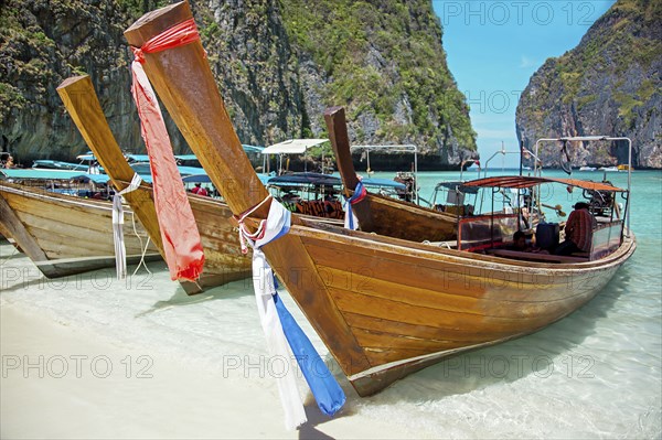 Long tail boats in the Maya Bay of Ko Phi Phi island Thailand