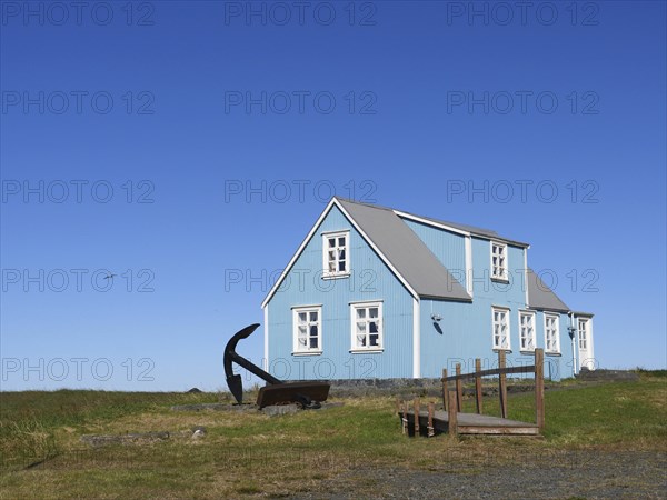 Blue house in Sandgerdi in the west of Iceland