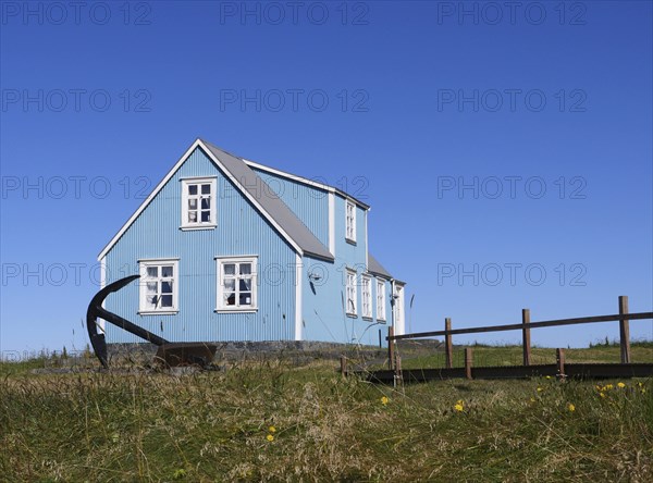 Blue house in Sandgerdi in the west of Iceland