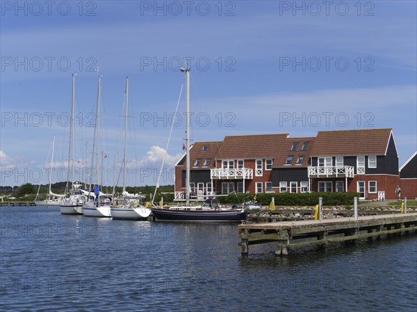 Klintholm Havn is a fishing village and popular holiday resort on the south coast of Mon, an island