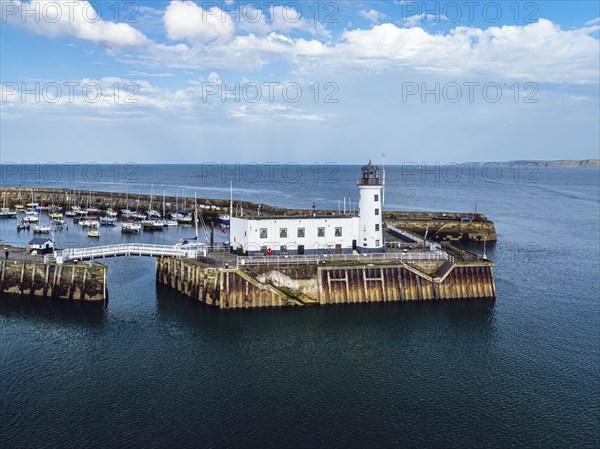 Scarborough Lighthouse and Harbour from a drone, Vincent Pier, Scarborough, North Yorkshire,