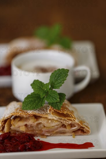 Austrian apple strudel on wood