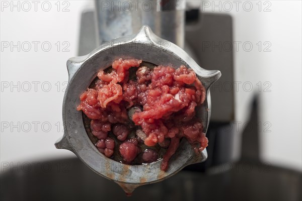Close-up of meat in the mincer