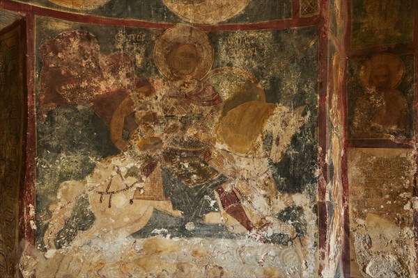 Detail of a mural in an old church depicting religious scenes, Agios Georgios on horseback,