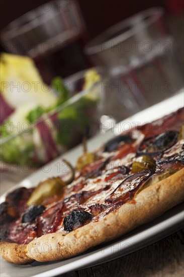 Pizza with ham and olives