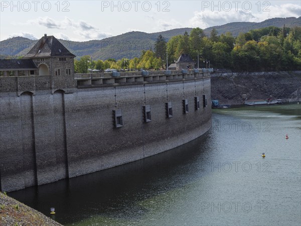 Massive dam impounding a river with neighbouring forest and hilly landscape, Waldeck, Hesse,