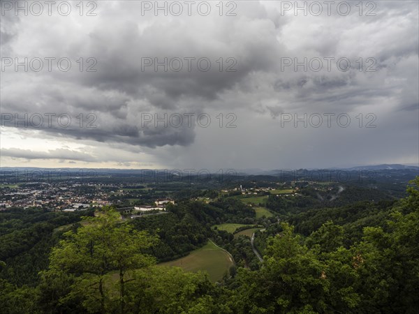 Storm clouds over Leibnitz, Seggau Castle, Frauenberg pilgrimage church in the background, view