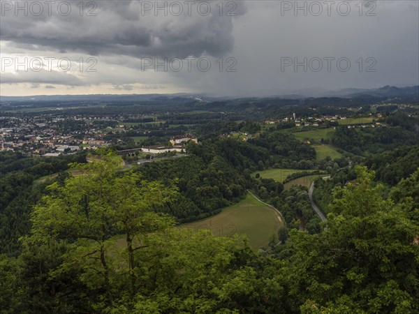 Storm clouds over Leibnitz, Seggau Castle, Frauenberg pilgrimage church in the background, view