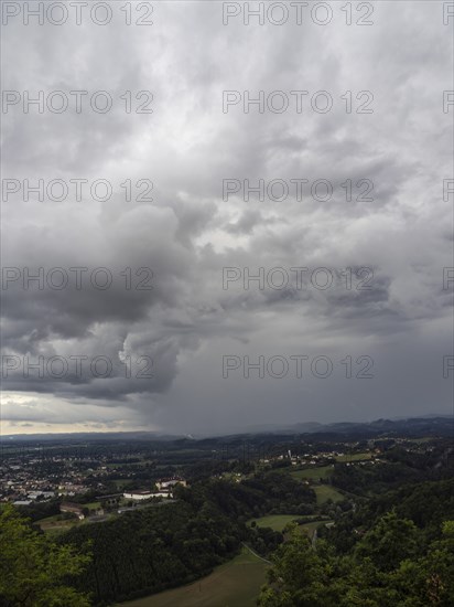 Storm clouds over Leibnitz, Seggau Castle, Frauenberg pilgrimage church in the background, view