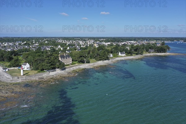 Aerial view coast of Loctudy with villas and lighthouse Phare de Langoz, department Finistere Penn