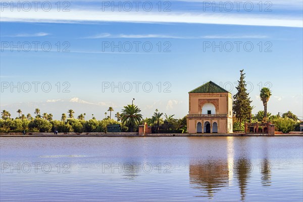 Famous Saadian pavillon reflecting in pool at Menara Gardens