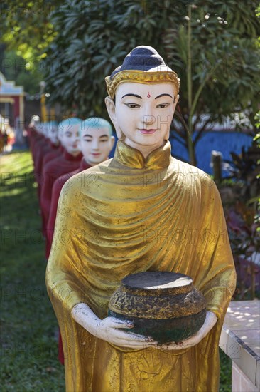 Long row of monk statues at Kaw Ka Thaung cave