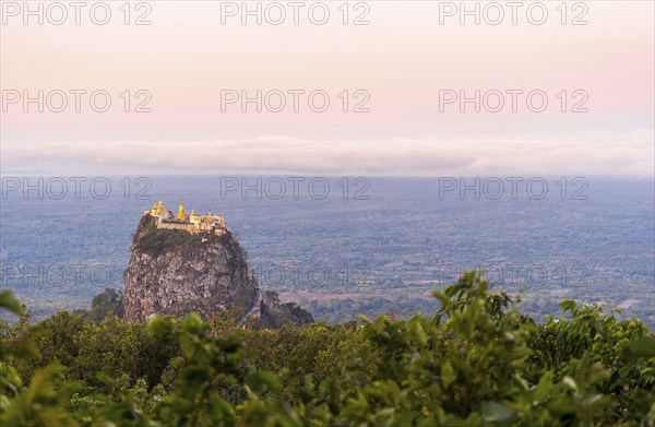 Taung Kalat Monastery seen from Mt. Popa Resort in Myanmar at dusk