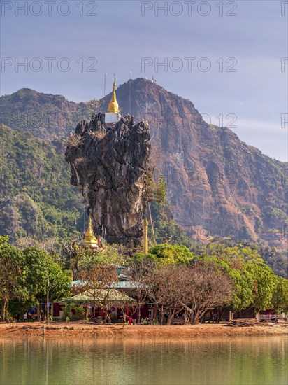 Amazing Buddhist Kyauk Kalap Pagoda under afternoon sky