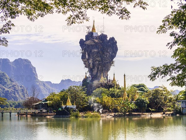 Amazing Buddhist Kyauk Kalap Pagoda under afternoon sky