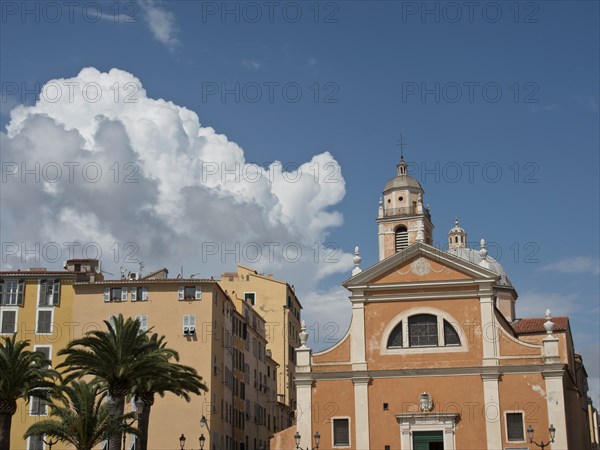 Church and surrounding buildings under a partly cloudy sky, ajaccio, corsica, france