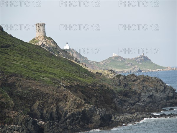 Coastal landscape with lighthouse on a rocky hill, ajaccio, corsica, france