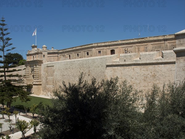 Close-up of stone fortress walls under a clear blue sky, mdina, mediterranean sea, Malta, Europe