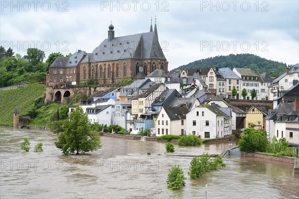 Flood of the river Saar, Saarburg in Saarland, Germany, flooded trees and paths, high water level,