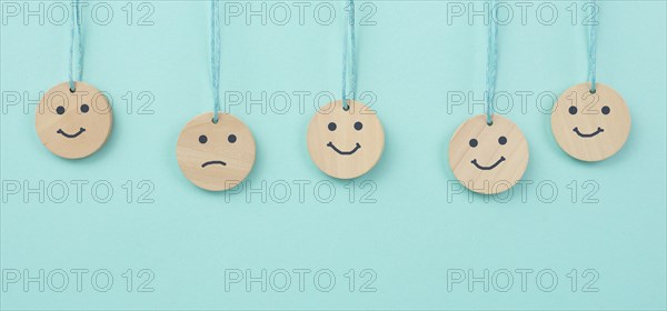 Happy smiling face spread happiness to sad faces, newton cradle concept, mental health and