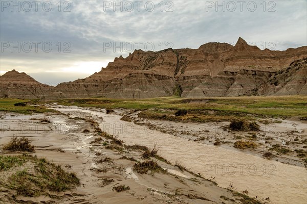 Badlands National Park, South Dakota, A stream runs through the normally dry landscape after a