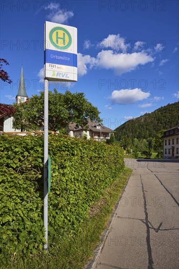 Bus stop in the centre of the 7321 bus route with St. Wendelin church in the historic district of