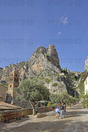 Church tower of Notre-Dame-de-l'Assomption and view to the rock, cliffs, mountains, summit,