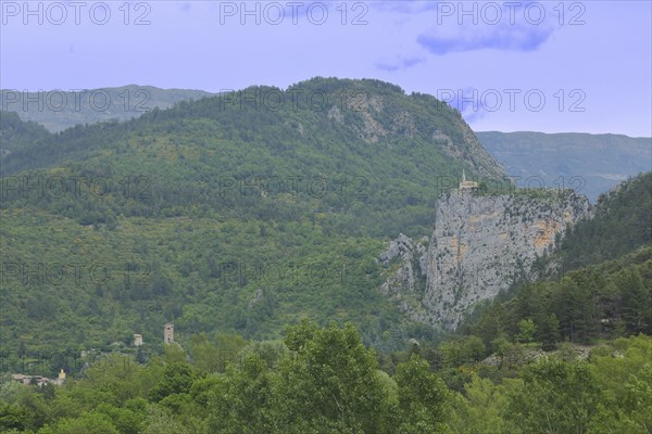 Rock Le Roc with church Notre-Dame-du-Roc, top, on, high, cliff, landscape, mountains, Castellane,