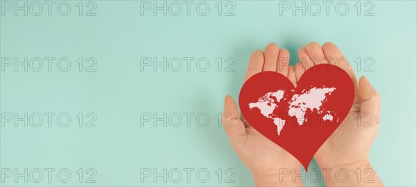 Red heart with world map, awareness of heart disease, humanitarian help, blood donor day, charity,