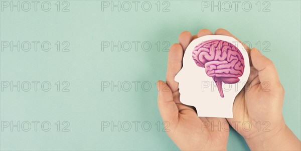 Holding a brain in the hands, Parkinson disease, Alzheimer awardness, mental disorder dementia,