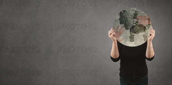 Domestic violence, hand hits face of abused woman, international awareness month october for