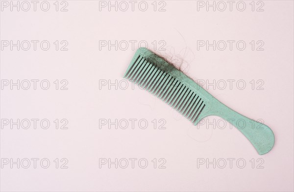 Comb with hair loss, health problem, issue of aging, alopecia areata by stress or infection,
